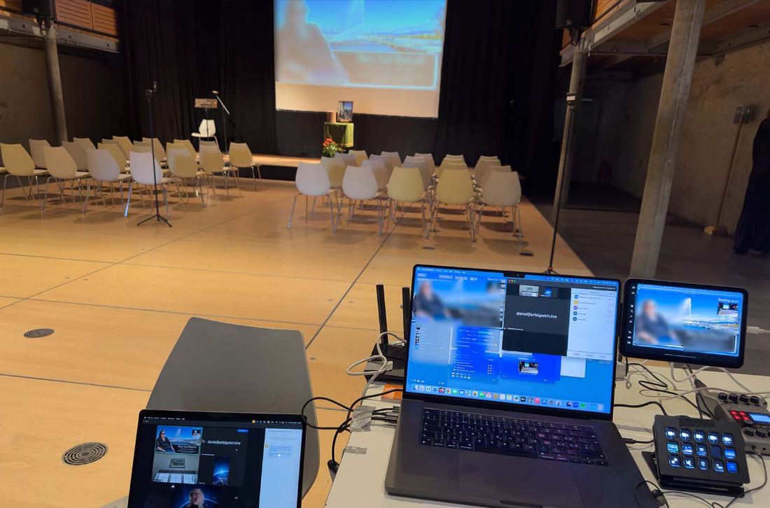 Tribute slideshow projected on screen during a live-streamed farewell