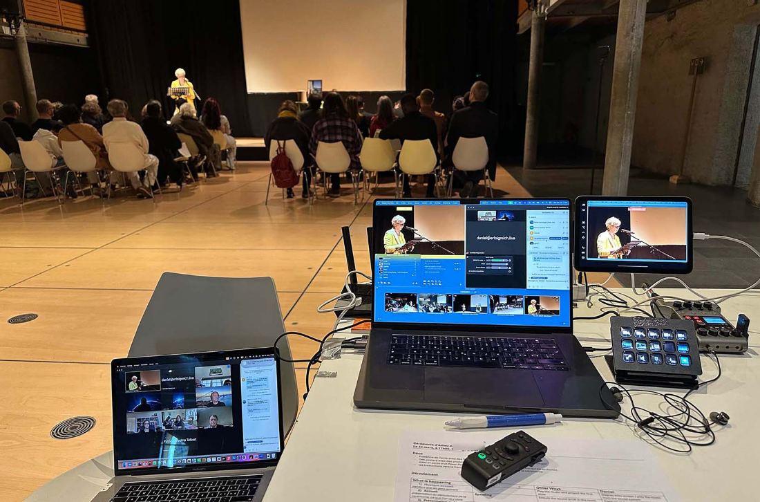 Funeral live streaming operator station facing the congregation
